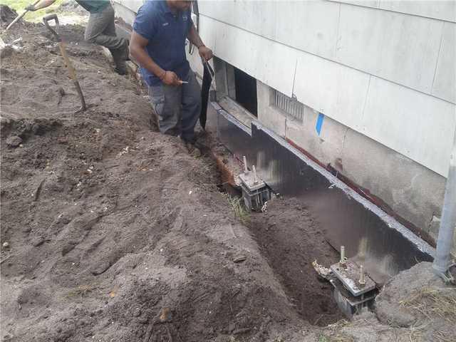 Helical Piers near Foundation