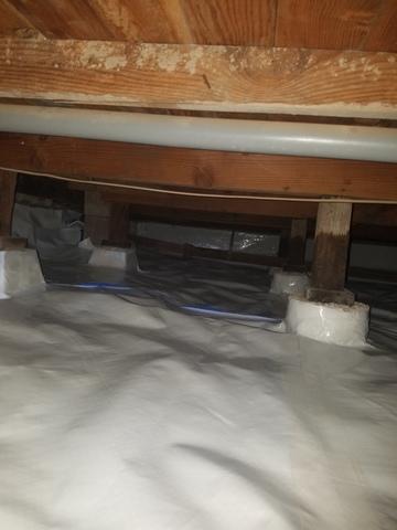 Crawlspace liner sealed around piers