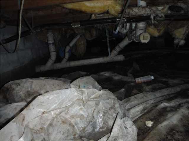 You can see that the light plastic sheets have been crumpled and damaged by rising waters in this crawl space in Georgetown, DE.