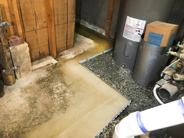 The WaterGuard System lays underneath the freshly laid cement.  It will take any water that enters the basement and bring it to the SuperSump Pump.