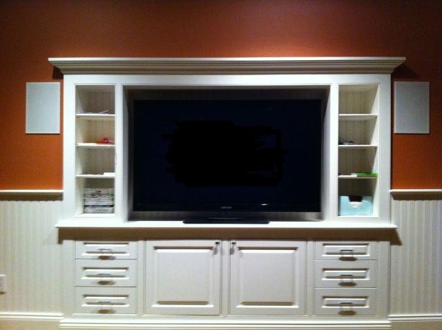 Entertainment system with lat screen in custom built in cabinet
