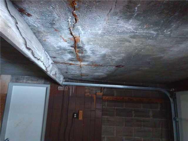 Cracked Basement Ceiling and Rotting Beams
