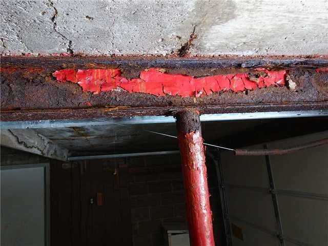 Even the areas where someone had sistered a steel beam to the existing support were failing, as the beam and support post rusted through.