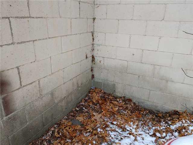 The block walls in the basement were wet inside and out, as it was an area of major water flow from the roof.