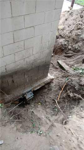 Once the piers are drilled down to a predetermined depth, we attach them to the foundation.