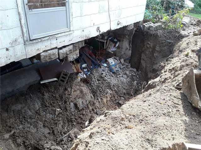 To rebuild the block foundation, our crews had to excavate first.