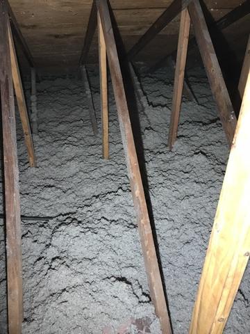 This shows the cellulose settling on the attic deck.