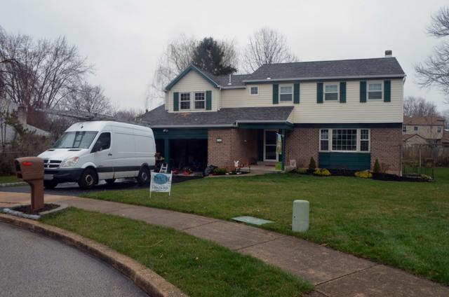 This final photo shows the new Owens Corning shingle roof and fiberglass windows.