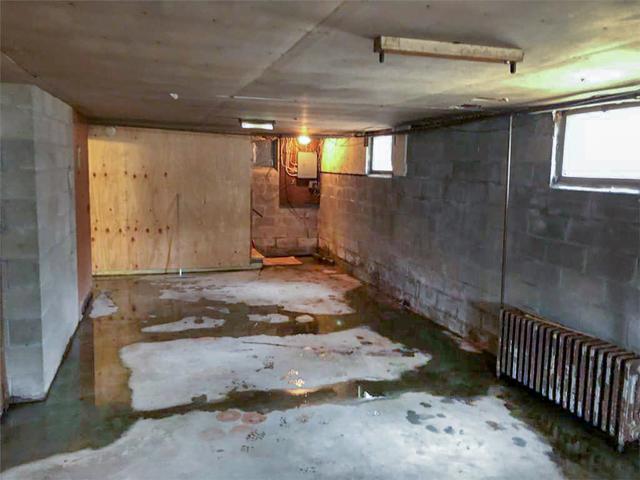 A before picture of the basement with quite a bit of water entering.