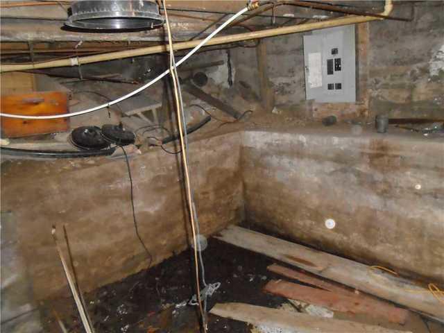 Another photo of the wet, cracked basement