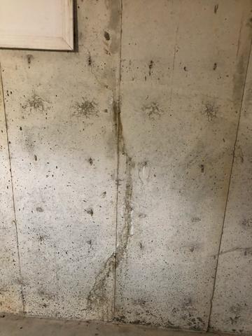 Water seeping through poured foundation wall