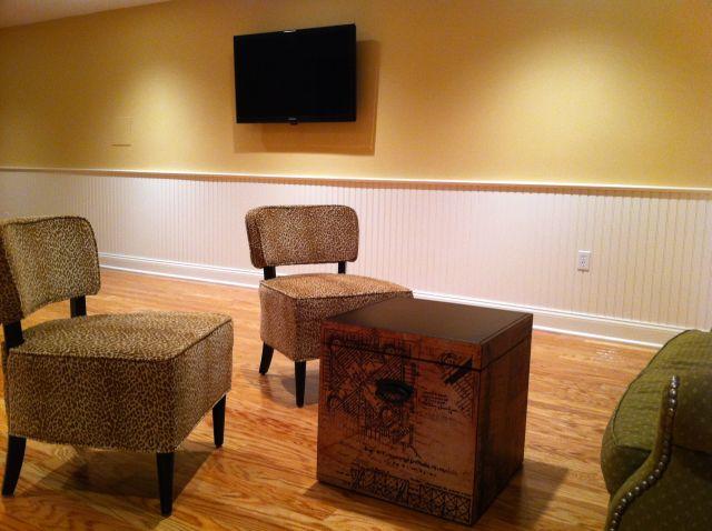 TV installation on wall with custom lighting control in billiard room