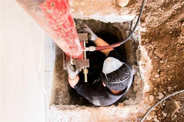 Each Push Pier section is hydraulically driven through the bracket to stable soil. The weight of the home is then transferred from the foundation through the bracket and piers to deep load- bearing soil.