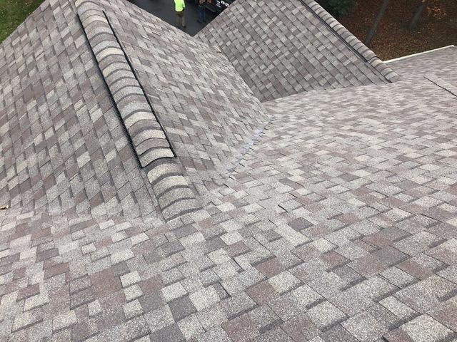 <p>The new shingles, ridge vent & ridge cap shingles are installed.</p>