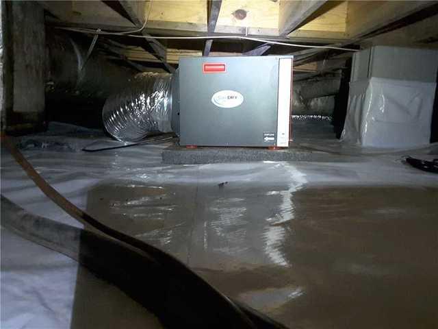 A SaniDry Sedona dehumidifier was installed to remove moisture from the air.