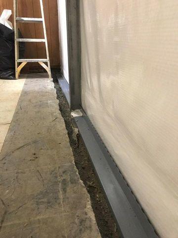 The front of the basement floor was jack hammered and Waterguard installed. CleanSpace Wall used on front wall to keep moisture out.  Power braces were used to stabilize the wall.