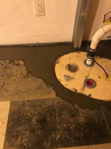 Corner of basement with sump pump