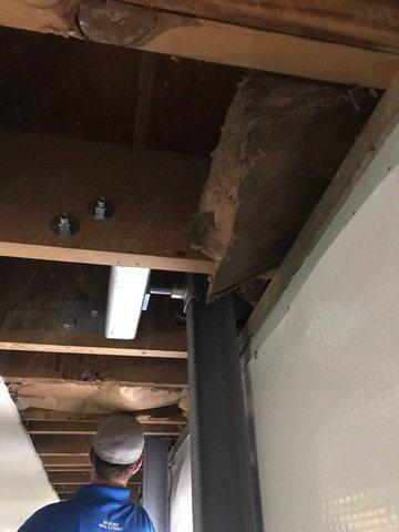 The Power Brace is placed along the wall and under the floor joists above.