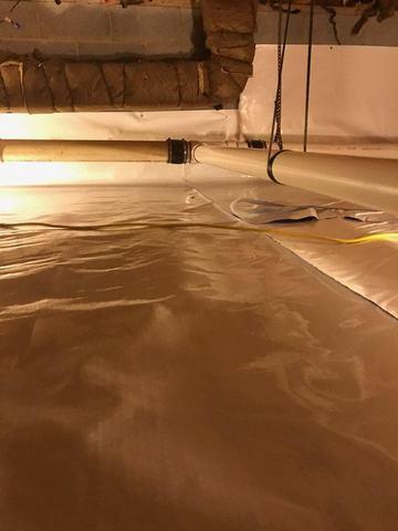 The discharge line from the installed Super Sump in the basement is run through the area and outside.