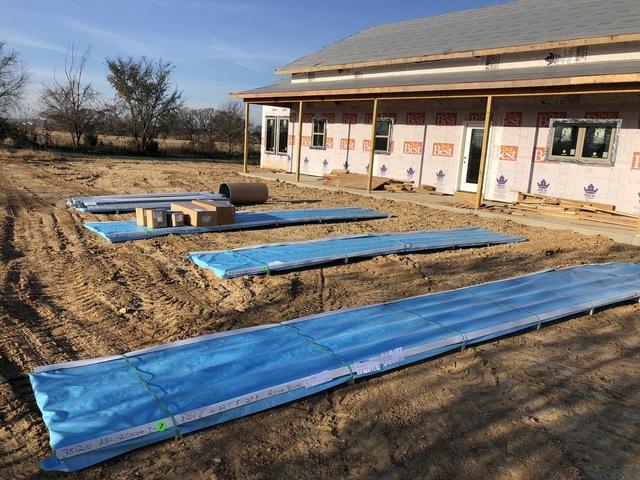 <p>In the picture all of that material is going to cover 6,300 square feet. The homeowner was surprised that those 4 piles of material was going to be enough to complete his roof.</p>