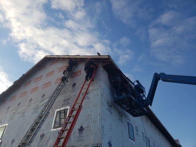 <p>We are working off the boom & ladders to install the fascia & soffit.</p>