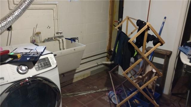 Amy was worried about water seeping into her basement where the wall meets the floor. If you look closely at the floor tiles near the wall, there is discoloration likely caused by exposure to water. This is evidence needed to back up Amy's claim.