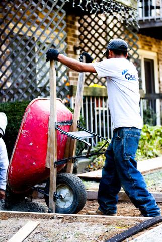 For harder to reach areas, Corey poured the concrete in to the wheel barrow and then the contracting team dispersed the concrete where it was needed.