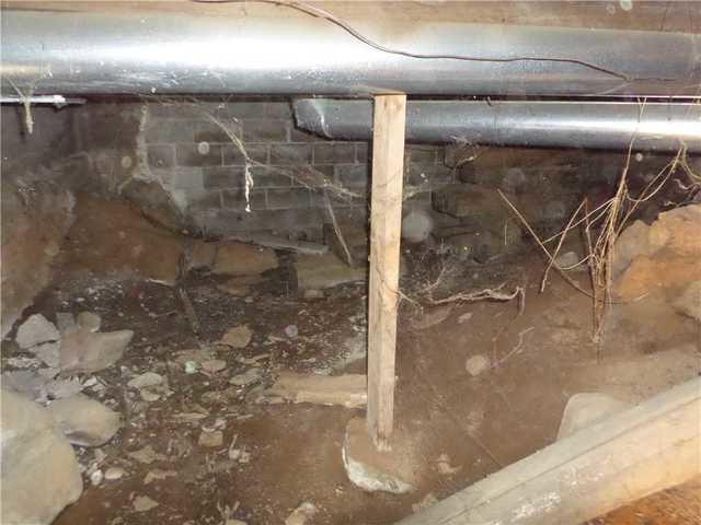 This photo was taken prior to the service. It displays the lack of support the crawl space was receiving.