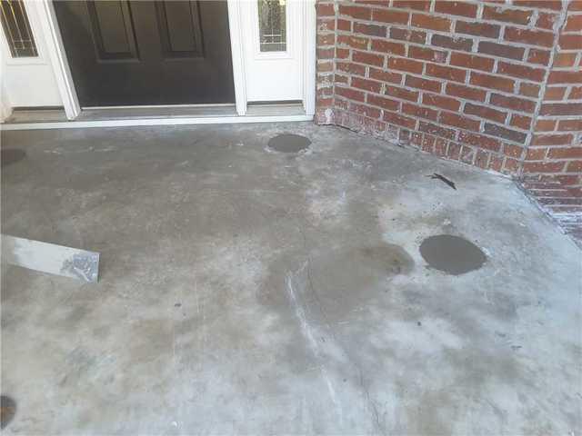 The finished, level concrete porch