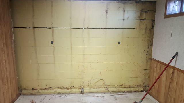 Severely cracked and bowing foundation wall.