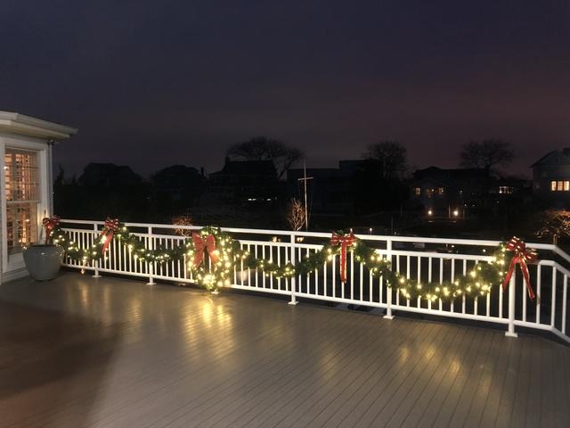 Why just decorate the front of your home? This homeowner added lit garland to the sides and back of his home, creating a display that can be enjoyed from any and every angle.