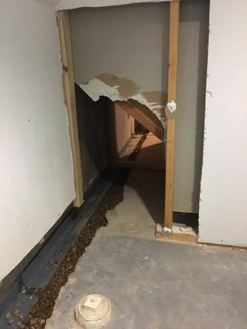 The dividing wall was removed and we were able to go right under the stairs to make sure the whole perimeter was protected.