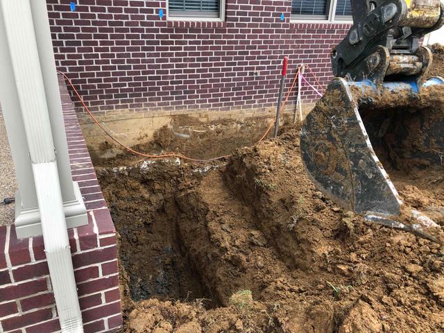 Excavating The Soil Around Foundation
