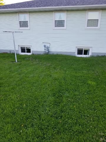 View of outside home before the radon mitigation system installation.