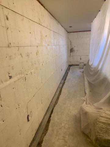 Concrete is removed and WaterGuard is installed around the perimeter of the basement.