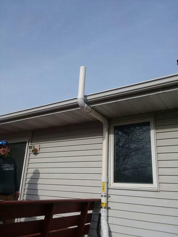 Radon mitigation system is installed. Radon gas is being pushed out and away from the home.