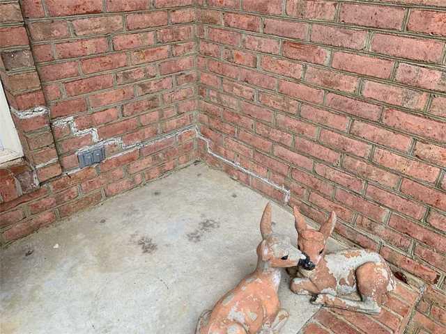 This porch cracked and sunk over a 12-foot section