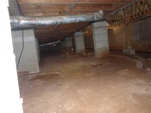 Moisture seeps in from dirt floor crawl spaces