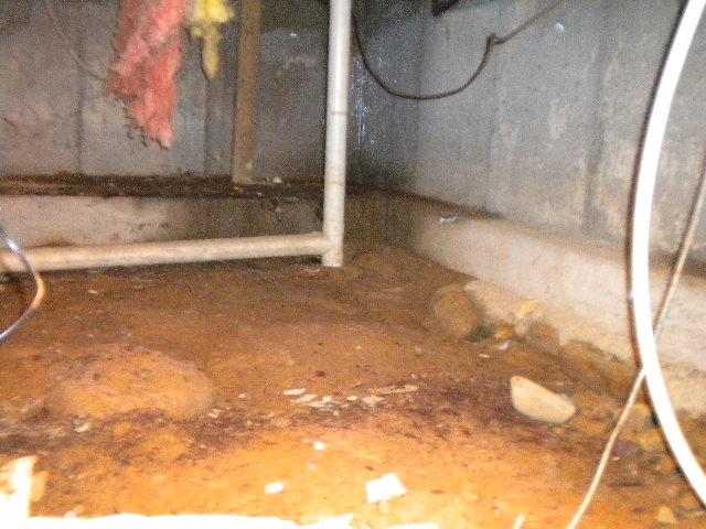 The crawlspace of this Oneco, CT home was unsealed from the outside air. Its dirt floor allowed moisture to enter the area, causing water problems for the home. We sealed the crawlspace with our CleanSpace crawlspace encapsulation system, and we installed our SuperSump pump system. The sump pump is capable of discharging up to 2,500 gallons of water per hour from the area, keeping the crawlspace dry for the homeowners to use. 