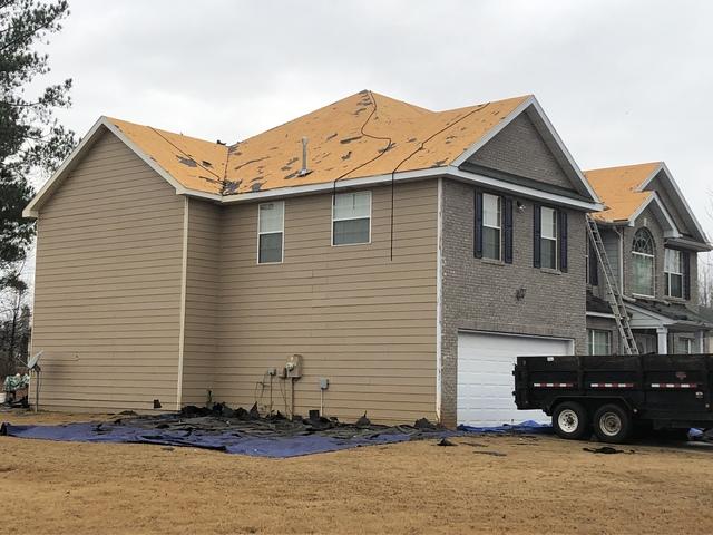 Here we have removed the old wether damaged shingles all the way down to the bare OSB decking.