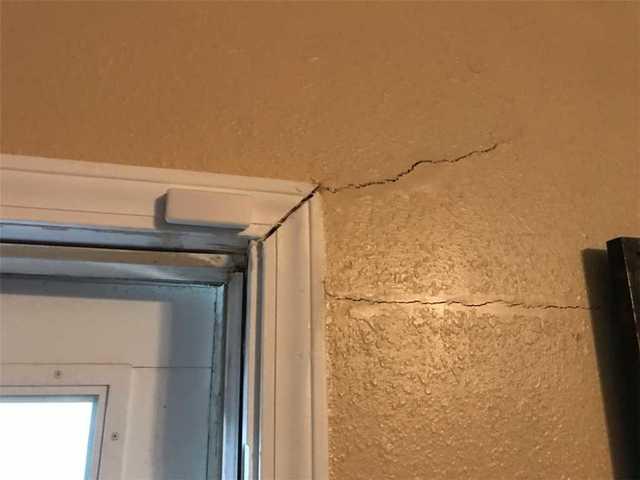 These cracks were caused by the sinking action of the foundation