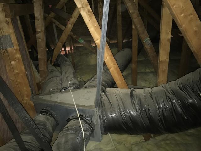 This 'cheese wedge' supply duct is constantly exposed to whatever temperature the attic is, making the duct system work less effectively.