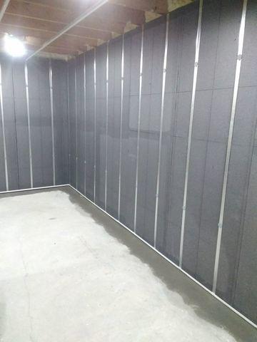 The project is complete. The Basement To Beautiful Wall Panels, WaterGuard, and spray foam have been installed. The basement has been transformed into a healthier, functional space!