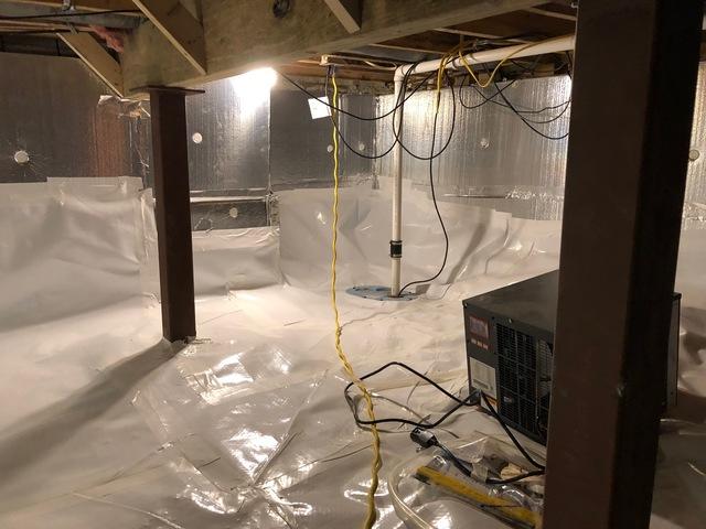 The CleanSpace Liner has been installed on the walls and floor of the crawl space to provide a vapor-proof barrier between the ground and floor.