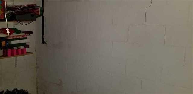 There were many cracks in the foundation wall.
