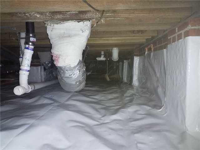 Lowcountry Basement Systems installed a Complete CleanSpace Encapsulation System to remove moisture and reduce humidity under the home.