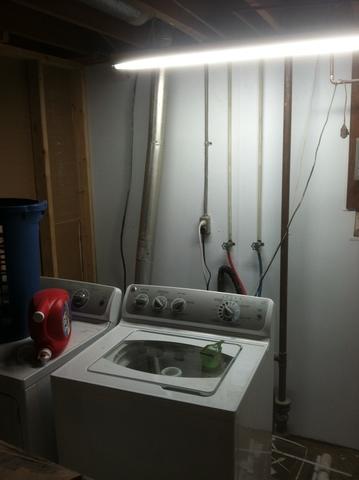 Installation behind utilities and plumbing in Evansville, IN basement