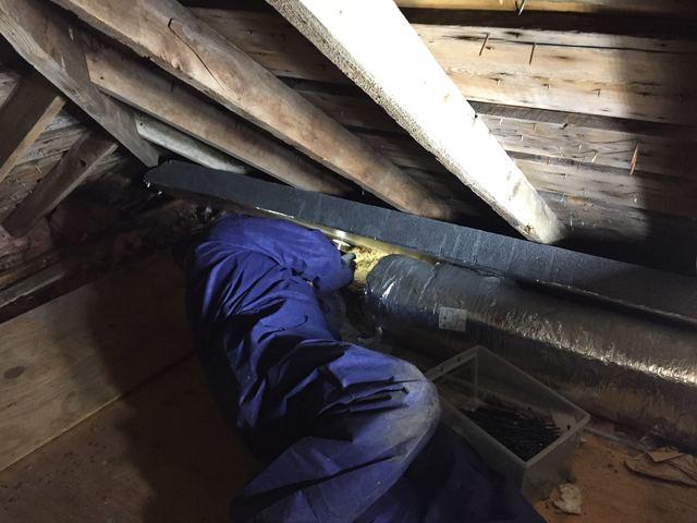 <p>installing Silver Glo in an attic&nbsp;</p>