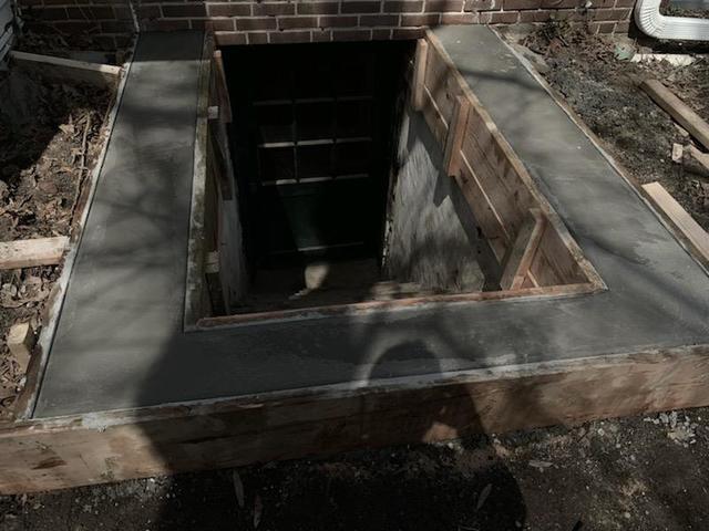 Our crew did a few masonry repairs to this foundation to allow the replacement custom angle door to fit perfectly.