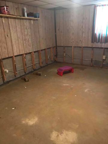 Once Team Woods vacuumed the water out of the basement, the next step was to remove the lower section of the walls. These walls needed to be removed to make room for the drainage system that would be installed.